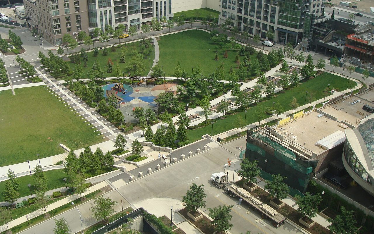 Lakeshore East Park seen from above, ringed by towers
